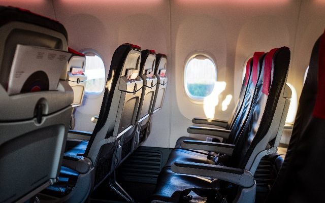 Where To Sit On A Plane To Avoid Getting Sick